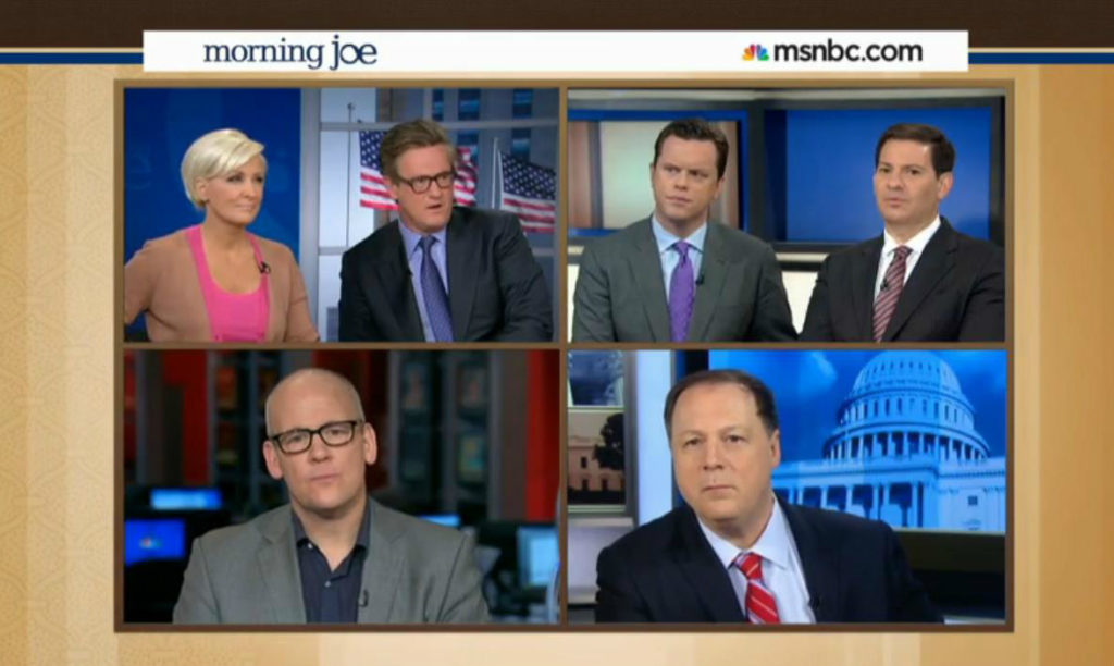 "We've discussed it amongst ourselves and decided that racism is over." (Photo: Screen grab from 'Morning Joe' where they actually did this.)